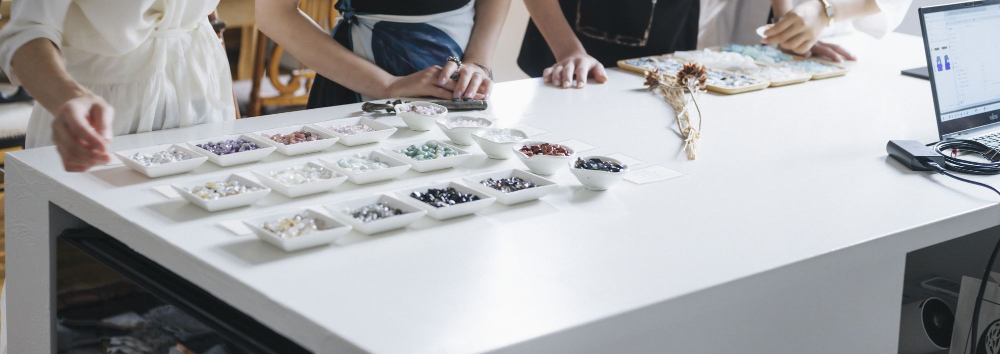 meme leading a Kintsugi workshop around a studio table