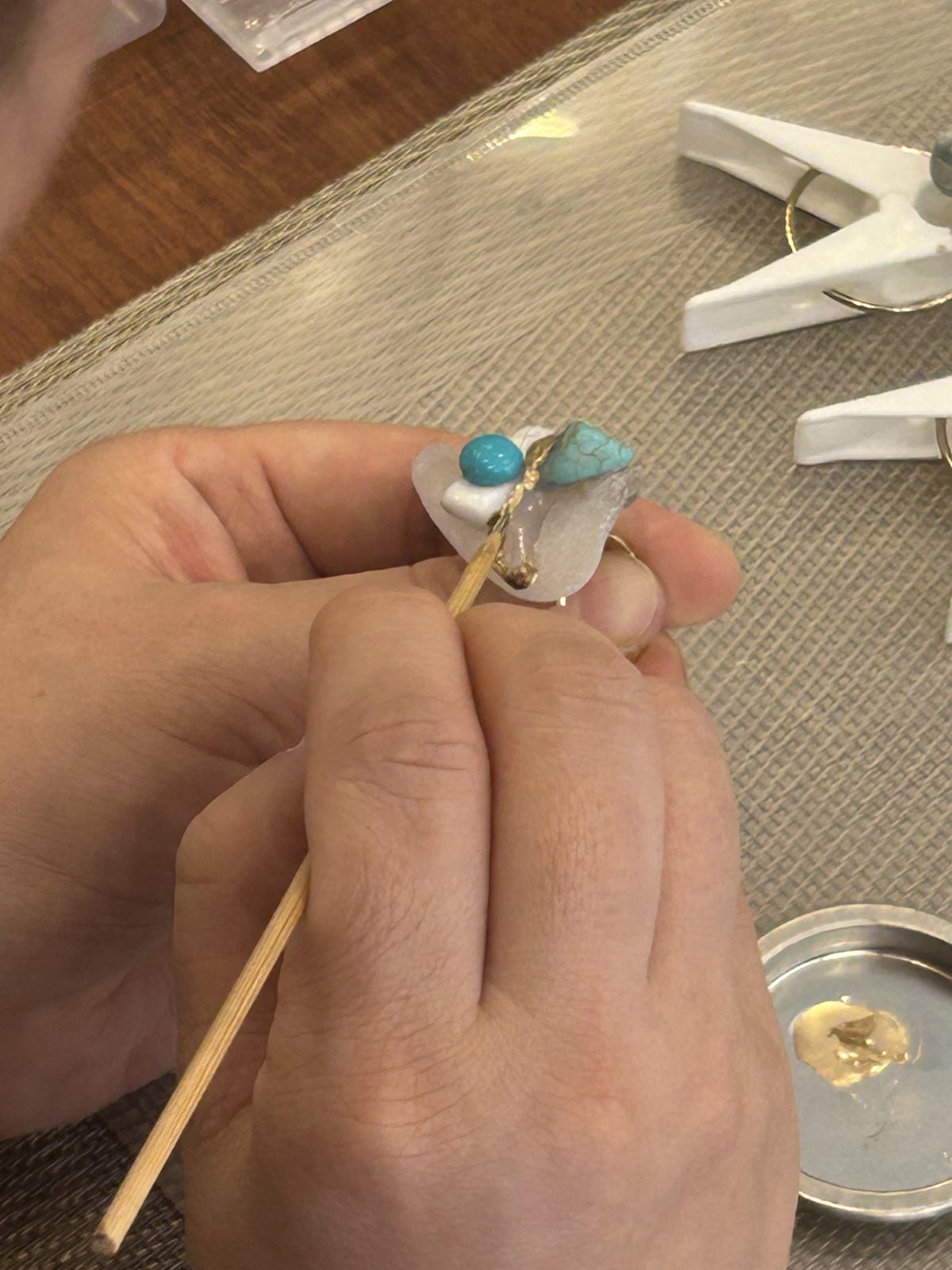 Turquoise joined to quartz in gold
