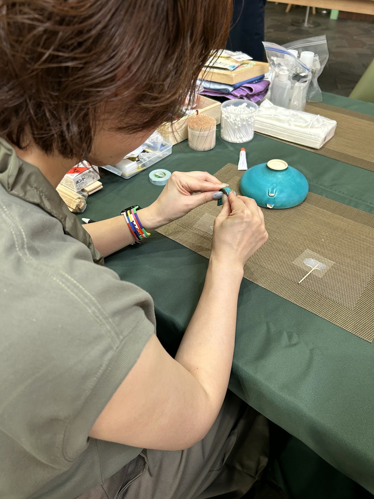 Lacquer brushed onto a teal bowl