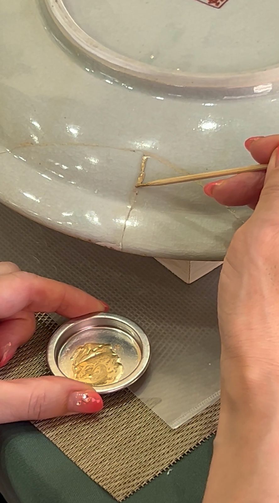 A white plate, mended in gold